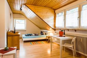 a living room with a bed and a staircase at Gala in Stockach +2 photos