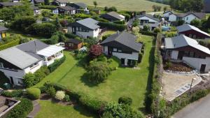an aerial view of a house in a suburb at Haus am Hennesee in Meschede