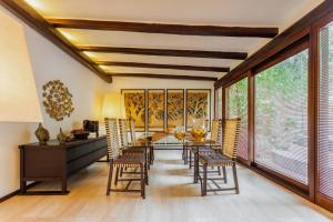 a dining room with a table and chairs at Villa Rokkaria in Villasimius
