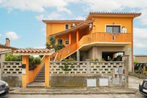 a house with an orange at Gaia Casa Vacanze in San Giovanni Suergiu