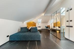 a bedroom with a bed and a bathroom at App 304 Palazzo Cavour in Bolzano