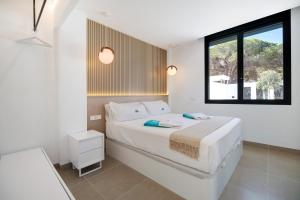 a bedroom with a large bed and a window at Andrea Sea Villa in Novo Sancti Petri +31 photos