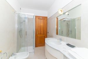 a bathroom with a sink and a shower and a toilet at San Teodoro Villa Nina Costa Caddu in San Teodoro +22 photos