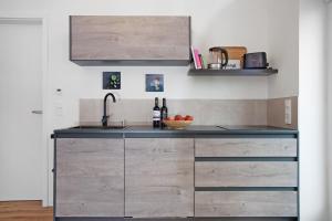 a kitchen with a sink and a counter top at Ferienwohnung Junge in Halblech