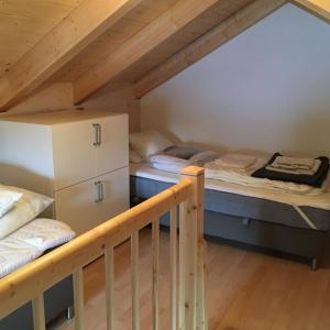 a room with two bunk beds and a staircase at Ferienhaus Seltschach 193 in Arnoldstein