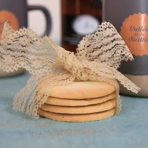 a stack of cookies on a counter with a towel at Pause Tranquille - Chambres d'hôtes in Sablé-sur-Sarthe