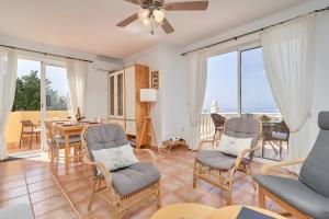 a living room with a view of the ocean at Villa Estrella de Cotobro in Almuñécar