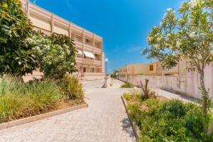 a walkway in front of a building at Casa Giselle a Otranto in Otranto