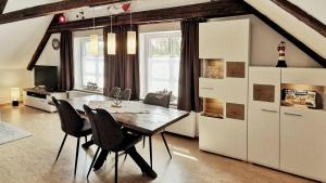 a dining room with a table and chairs at Ankerplatz in Lübeck in Lübeck