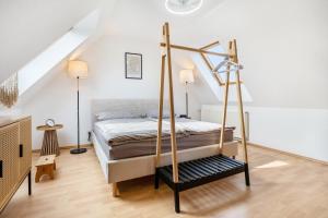 a bedroom with a bed with a swing at Haus Gertrud in Wiek auf Rügen