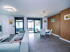 a living room with a couch and a table and chairs at Apartment Alexia by Interhome in Ifach +30 photos