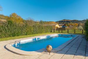 a swimming pool in the backyard of a home at La Miellerie in Gréoux-les-Bains