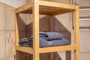 a pile of towels on a wooden shelf at Ferienhaus Brigitte - Breitnau in Breitnau +51 photos