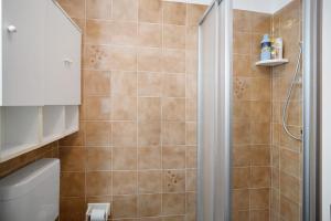 a bathroom with a shower and a toilet at Albenga Le Morelle 2 in Albenga +13 photos