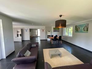 a living room with a couch and a table at Ferienhaus Rechlin in Rechlin