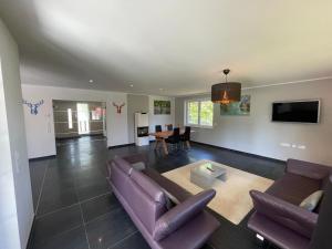 a living room with a couch and a table at Ferienhaus Rechlin in Rechlin
