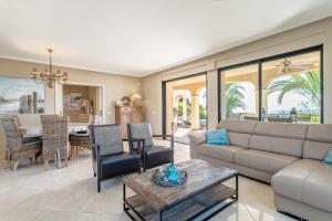 a living room with a couch and a table at Villa Mara in El Campello