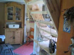 a room with a spiral staircase in a house at Villa Ilsebill in Ribnitz-Damgarten