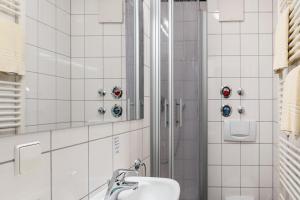 a bathroom with a sink and a shower at Ferienwohnung Tannenblick 1-2 in Oberhof +17 photos
