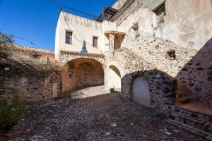 an alleyway in an old stone building at Hora Hora in Orosei