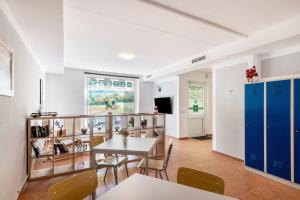 a dining room with a table and chairs at Ferienwohnung in Mecklenburg in Malchin