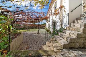 a set of stairs leading up to a house at Casa do Adro do Soajo in Soajo