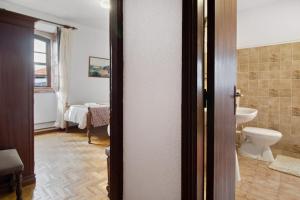 a bathroom with a toilet and a sink at Casa do Adro do Soajo in Soajo +87 photos