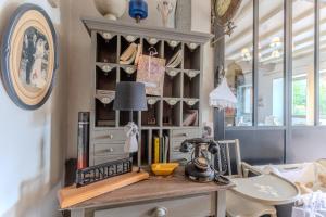 a room with a table with a lamp on it at Maison Loustalet in Arzacq-Arraziguet +30 photos
