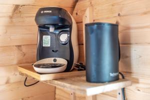 a coffee maker and a blender sitting on a shelf at Les Chouchous du Garthieu in Hourtin +60 photos