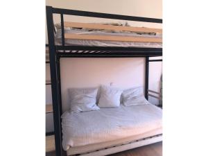 a bunk bed in a room with two bunk beds at Rayon de soleil Arcachon in Arcachon