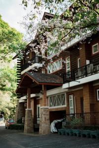 a large building with a balcony on top of it at Trivista Khaoyai in Ban Khanong Phra Klang (1)