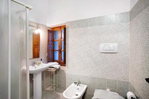 a bathroom with a sink and a toilet at Casa Verde - Sciu´ Pepin in Rezzo +16 photos