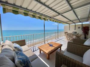 a living room with a view of the ocean at Flamingo in Tavernes de Valldigna
