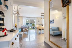 a kitchen and living room with a couch and a table at Kranich in Pruchten