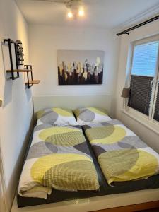 a bedroom with two beds and a window at Ferienhaus Haffschatz in Ueckermünde