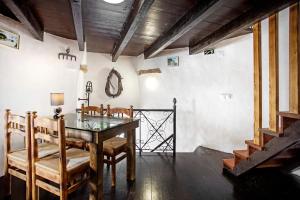 a dining room with a table and chairs at Moinho das Esteveiras in A dos Cunhados