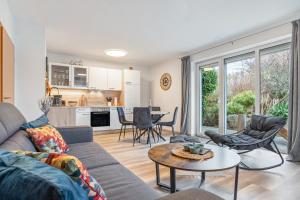 a living room with a couch and a table at Haus Gertrud in Wiek auf Rügen