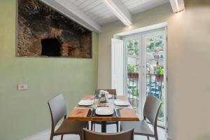 a dining room with a table and chairs at Dimora Storica Lucia in Ascea