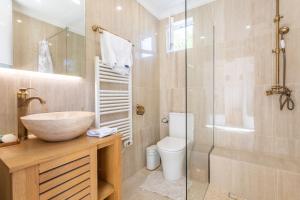 a bathroom with a sink and a glass shower at Studio Bormes in Bormes-les-Mimosas +14 photos