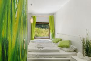 a small room with a bed and a window at db Staycation Ferienpark in Niedenstein