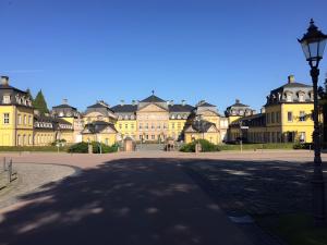 a large yellow building with a street light in front at Am Trapp in Padberg