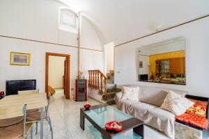 a living room with a couch and a table at Elena Inn in Matino +16 photos