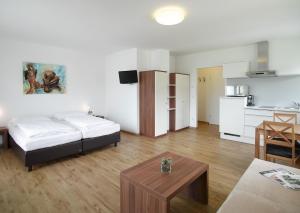 Kuchyň nebo kuchyňský kout v ubytování Aparthotel Fürst