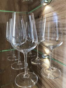 a row of wine glasses sitting on a table at Ferienwohnung Immenberg in Dirlewang