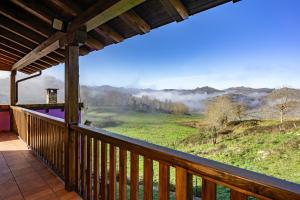 a view from the deck of a cabin with a view at Picuastur in Cangas de Onís
