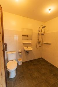 a bathroom with a toilet and a sink at Blue Heaven Resort Koh Tao in Ko Tao