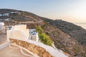 a view of a hill from a house at Paros - Sikinos Sunset in Sikinos +21 photos