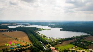 an aerial view of a lake with colorful flags at La petite ferme de Fine in Burg bei Magdeburg