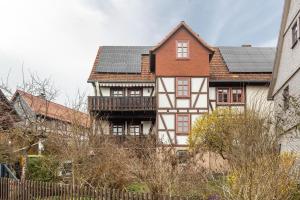 a house with solar panels on top of it at You R Welcome too in Frischborn