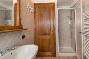 a bathroom with a tub and a sink and a shower at Stupendo rustico in pietra in Castellina Marittima +27 photos